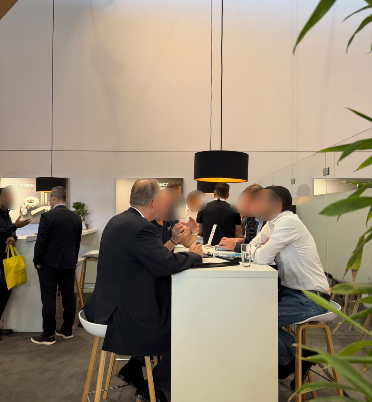 Technical discussion at the SUMITOMO booth during AMB 2026